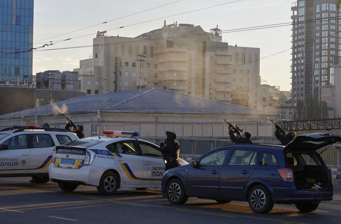 Ukrainian soldiers shoot a drone that appears in the sky seconds before it fired on buildings in Kyiv, on Oct. 17, 2022. (AP)