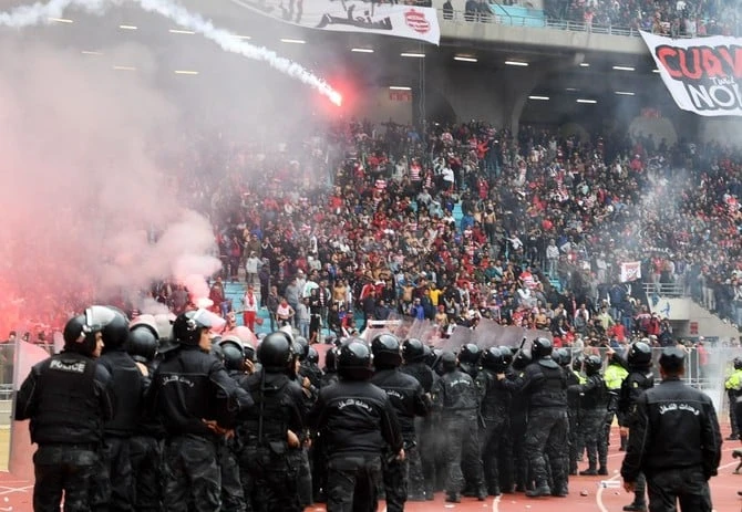 Twelve Tunisian policemen were jailed for two years Thursday for manslaughter in the case of a 19-year-old football fan who drowned in a stream while trying to escape them. (AFP/File)