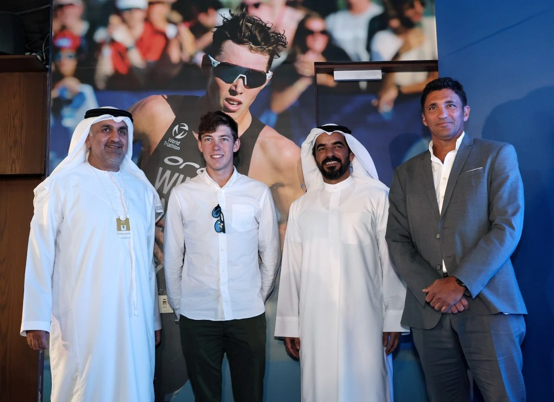 (from left) Aref Al-Awani, Secretary General of ADSC; Triathlon world No. 1 Hayden Wilde; Mohamed Al-Zaabi, CEO of Miral Asset Management; and Gary Marcia, Director of the World Triathlon Championships. (ADSC)