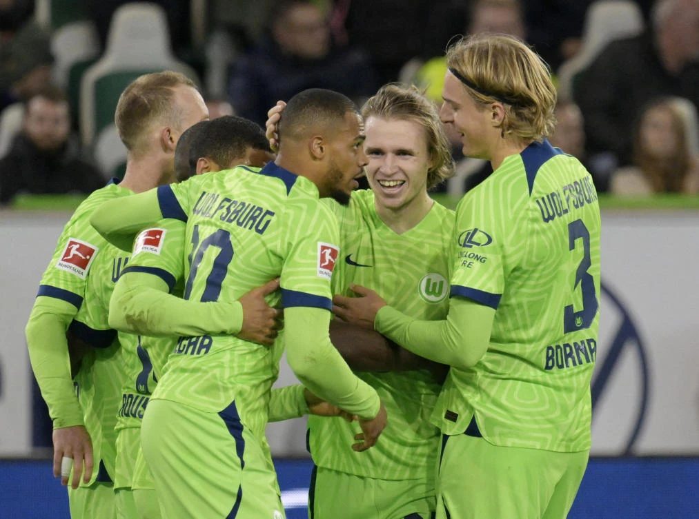 VfL Wolfsburg’s Lukas Nmecha celebrates scoring their second goal with teammates during their Bundesliga match against Borussia Dortmund at the Volkswagen Arena, Wolfsburg on Tuesday. (Reuters)