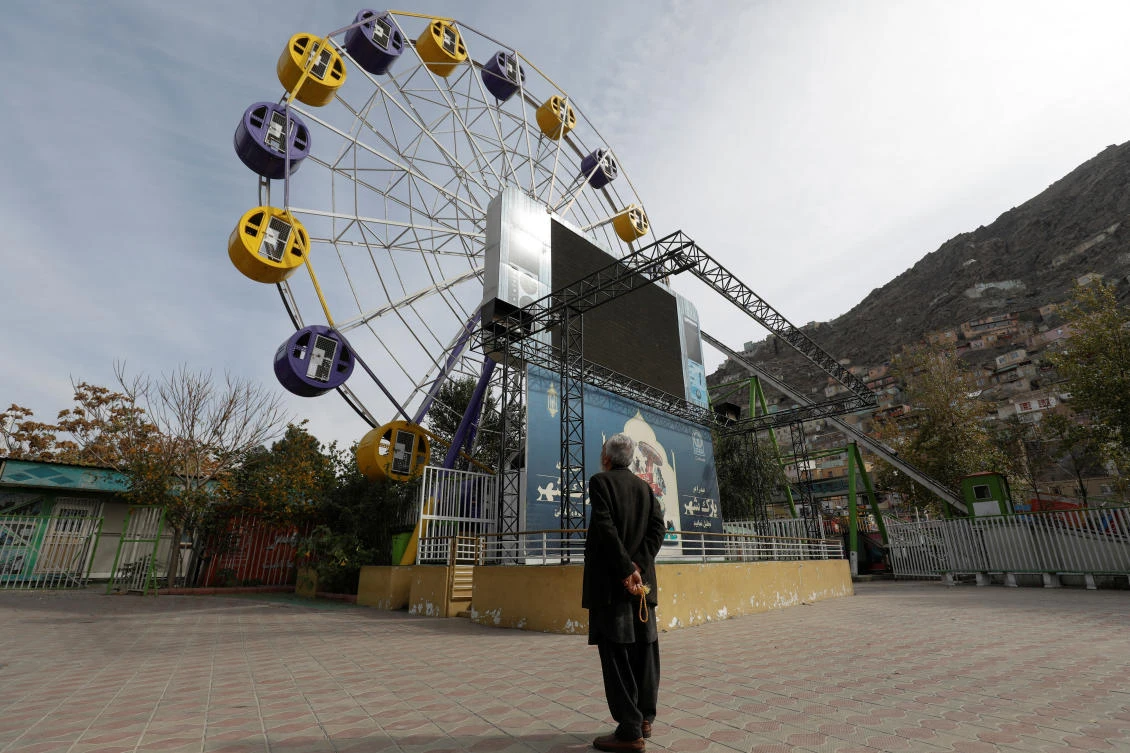 An Afghan man stands in an amusement park in Kabul, Afghanistan, on Wednesday. (Reuters)