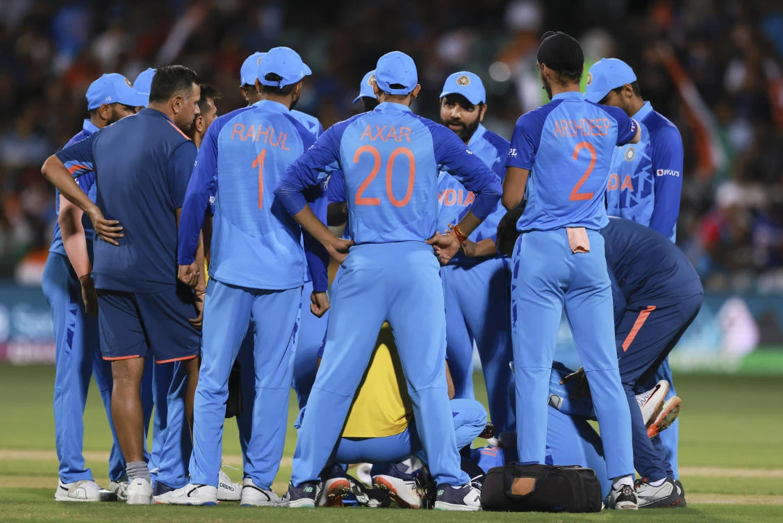 Indian players talk during a drinks break of the T20 World Cup cricket semifinal between England and India in Adelaide, Australia, on Thursday. (AP)