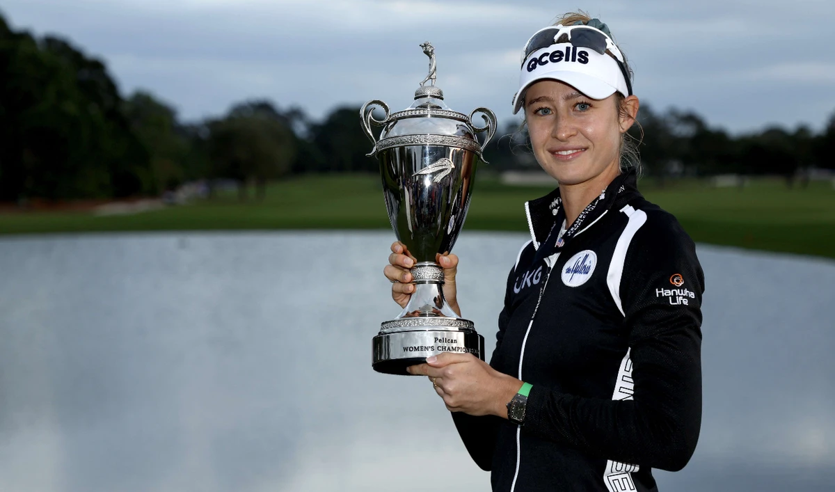Nelly Korda of the US with the trophy after winning the Pelican Women's Championship at Pelican Golf Club on Nov. 13, 2022 in Belleair, Florida. (AFP)