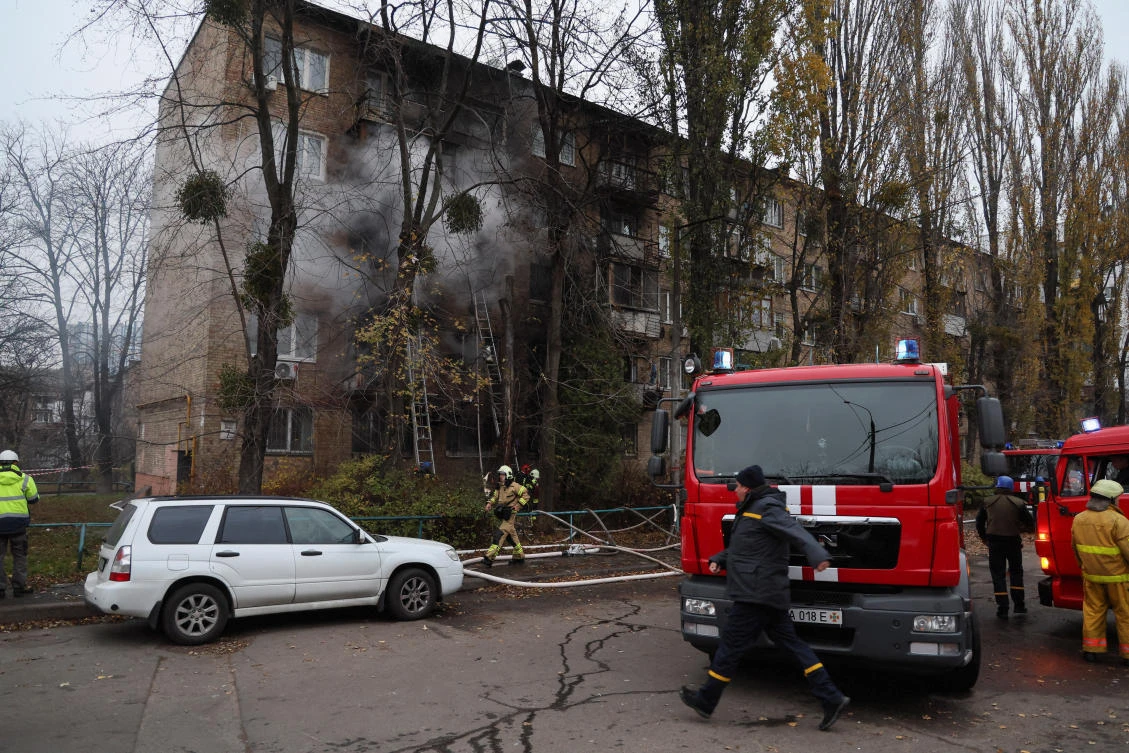 Firefighters work to put out a fire in a residential building hit by a Russian missile strike, amid Russia’s attack on Ukraine, in Kyiv, on Tuesday. (Reuters)