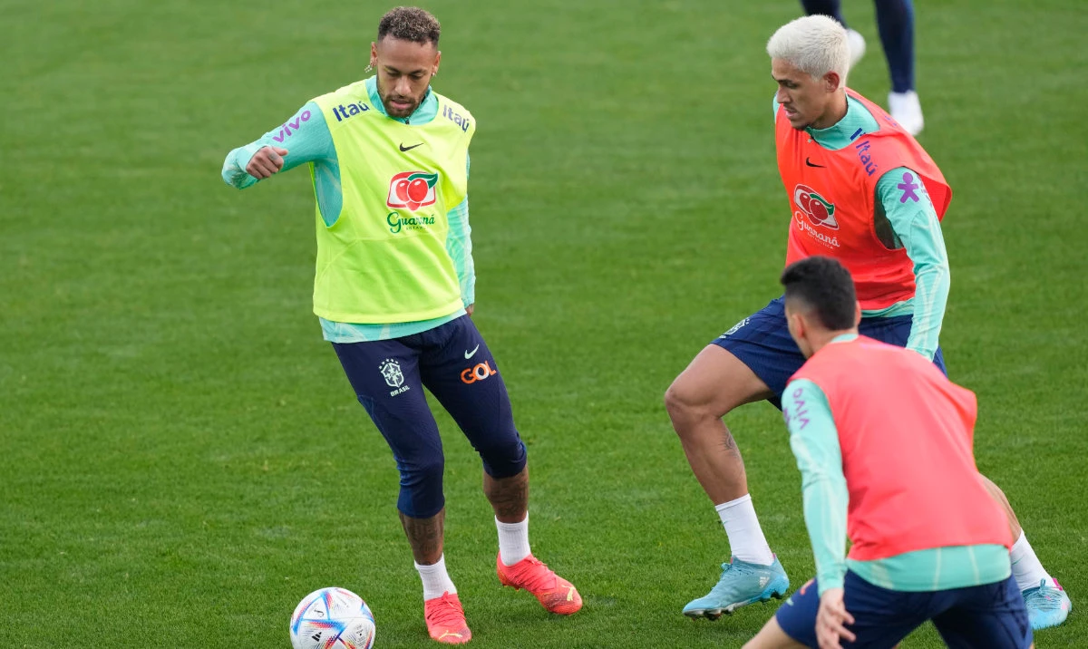 Brazil's Neymar, left, challenges for the ball with his teammates during a training session at the Continassa sporting center, in Turin, Italy, Tuesday. Brazil will compete in Group G at the 2022 FIFA World Cup. (AP)