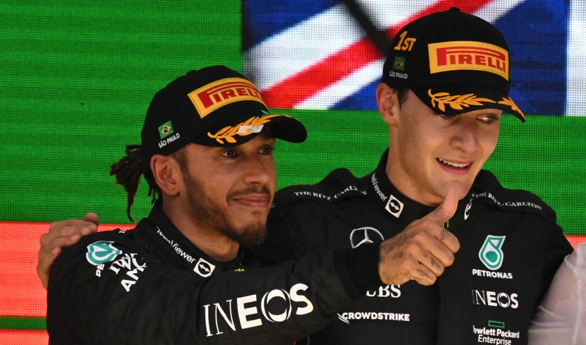 Second place Mercedes' British driver Lewis Hamilton (L) and winner Mercedes teammate George Russell celebrate in the podium of the Formula One Brazil Grand Prixon Nov. 13, 2022. (AFP/File)