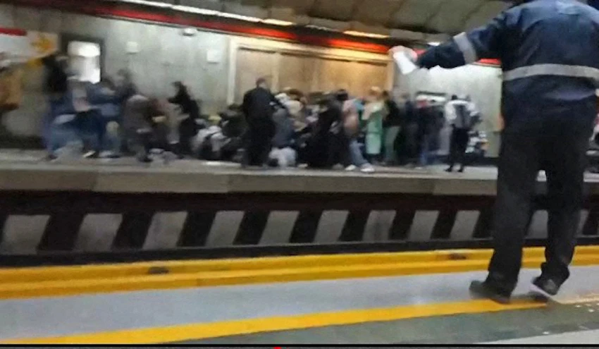 Iranians at a metro station in Tehran fleeing and falling down as gunshots are heard in this grab made available on Nov. 16, 2022. (ESN via AFP)