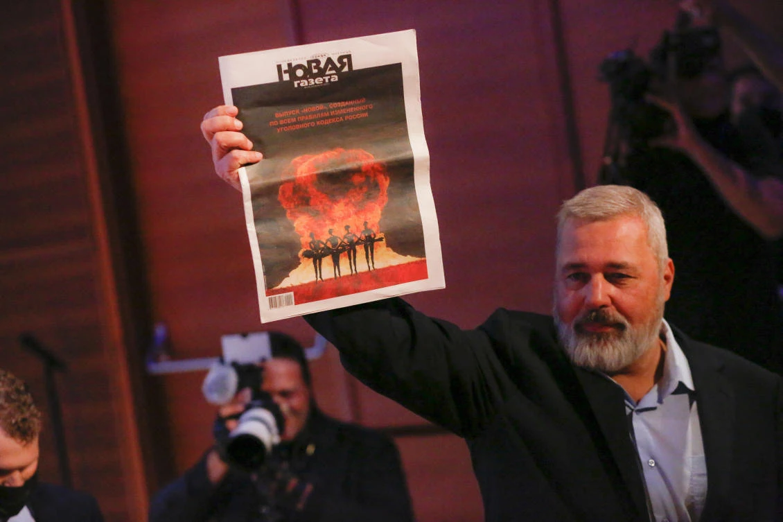 Editor-in-chief of Novaya Gazeta Dmitry Muratov celebrates after auctioning off his Nobel Peace Prize gold medal to benefit children. (AFP/File)