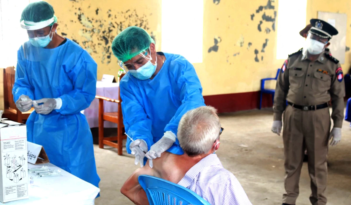 A detained Australian adviser to Myanmar's deposed leader Aung San Suu Kyi, getting vaccinated against the Covid-19 coronavirus in Insein prison in Yangon. (AFP file photo)