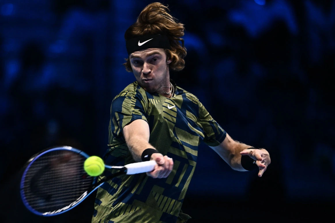 Russia's Andrey Rublev returns to Greece's Stefanos Tsitsipas during their round robin match on Friday at the ATP Finals tennis tournament in Turin. (AFP)