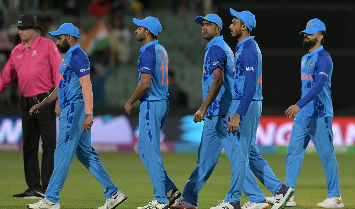 India's cricketers including Virat Kohli, right, walk off the field after their defeat in the ICC men's Twenty20 World Cup 2022 semi-final cricket match against England at The Adelaide Oval on November 10, 2022. (AFP)
