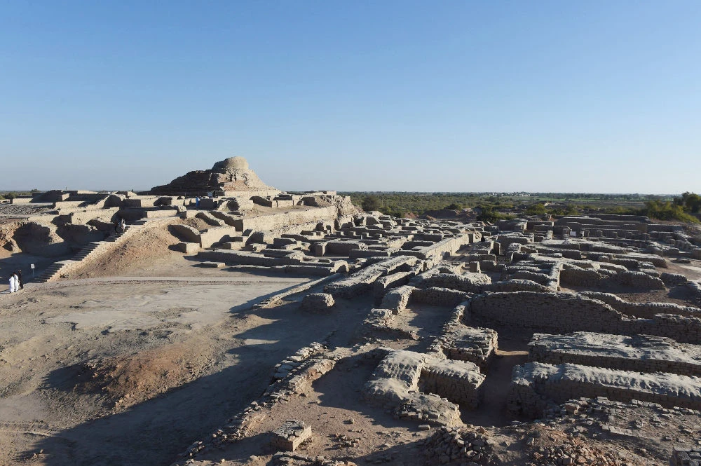 In this file photo taken on February 9, 2017 visitors walk through the UNESCO World Heritage archeological site of Mohenjo Daro some 425 kms north of the Pakistani city of Karachi. (AFP)