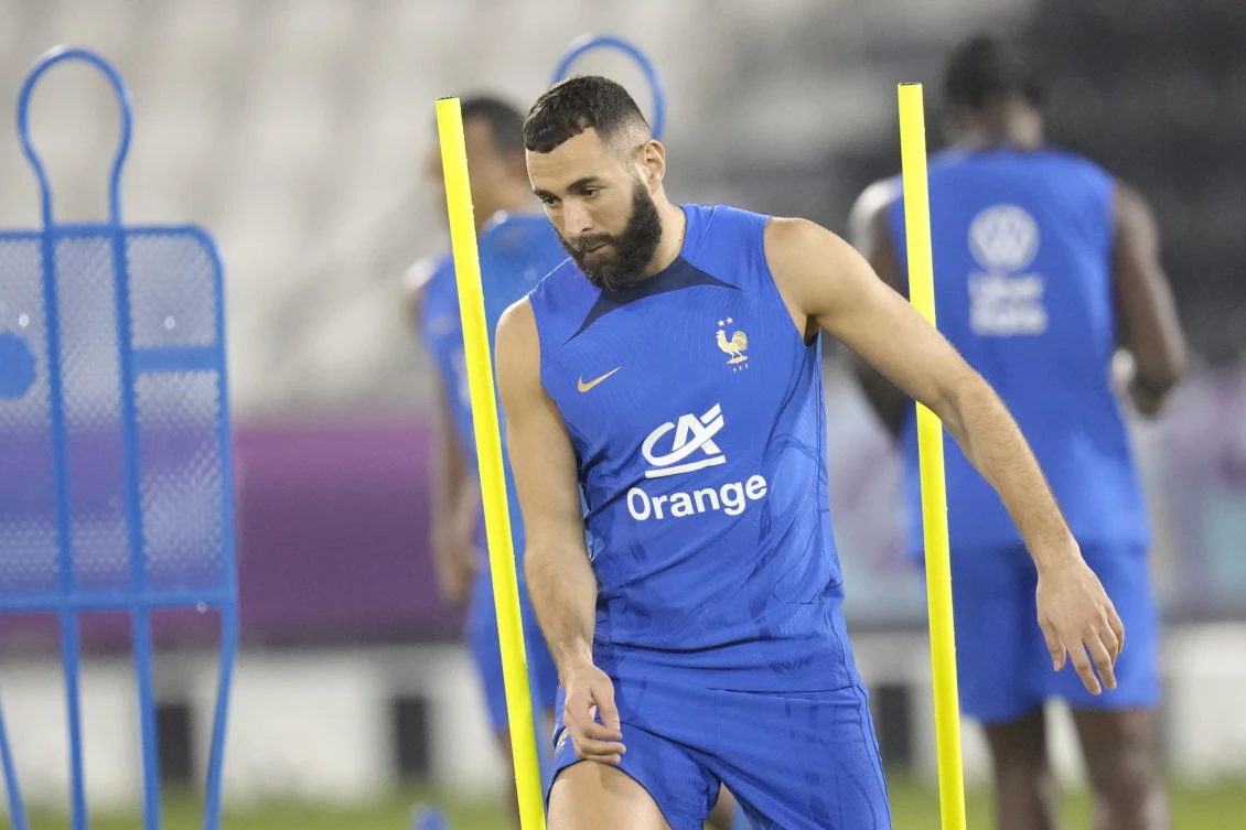 France’s Karim Benzema runs during a training session at the Jassim Bin Hamad stadium in Doha on Saturday. (AP)