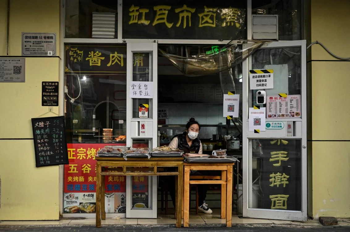 In the capital Beijing, residents were told not to travel between city districts, and large numbers of restaurants, shops, malls, office buildings and apartment blocks have been closed or isolated. (AFP)
