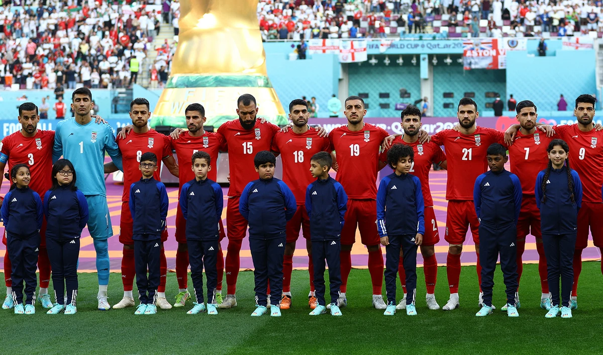 Iran players line up during the national anthems before the match against England during FIFA World Cup in Doha, Qatar, on November 21, 2022. (REUTERS)