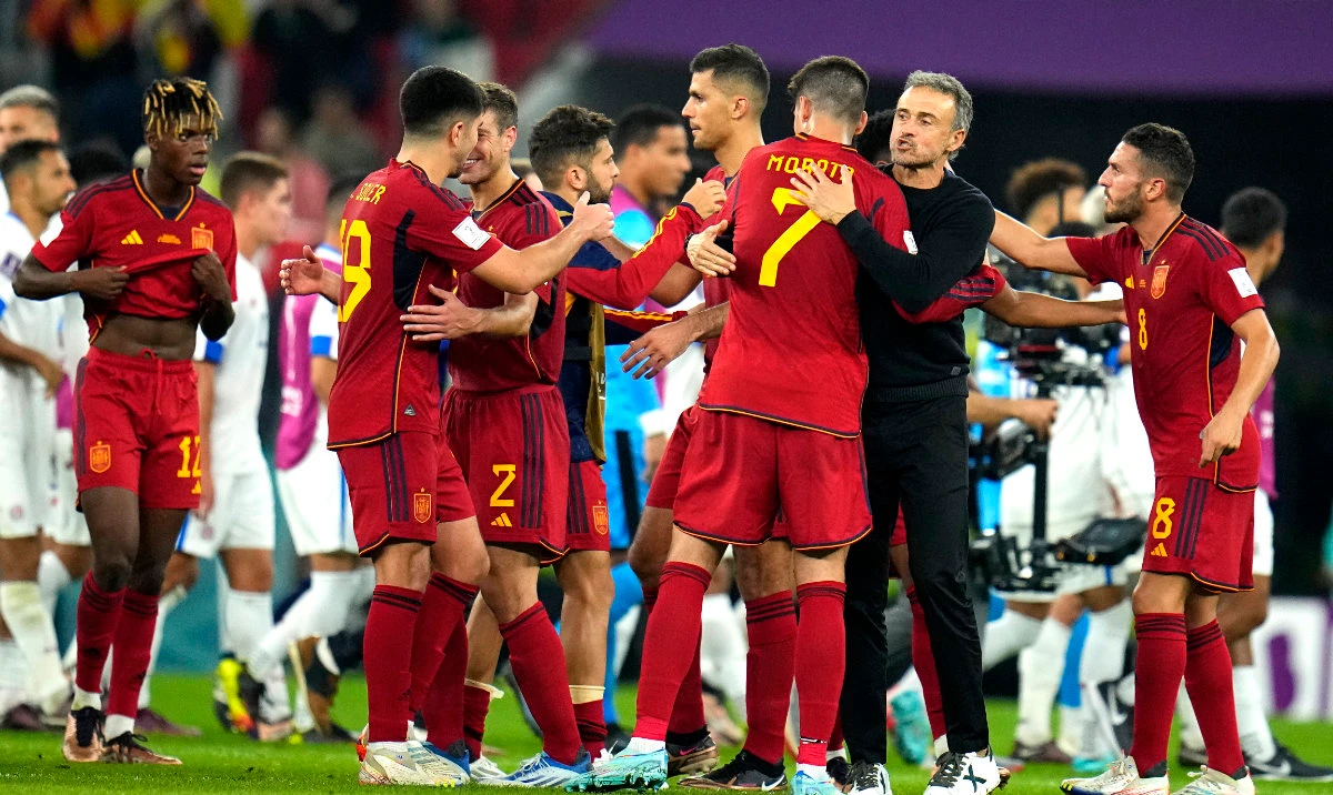 Spain's head coach Luis Enrique, second from right, celebrates with players at the end of the World Cup Group E match against Costa Rica at the Al Thumama Stadium in Doha Wednesday. (AP)