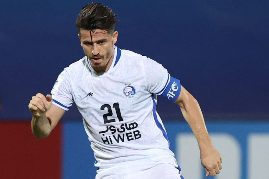 Esteghlal’s defender Voria Ghafouri plays during the AFC Champions League group C match between Saudi’s Al-Ahli and Iran’s Esteghlal in April 2021. (Photo by AFP)