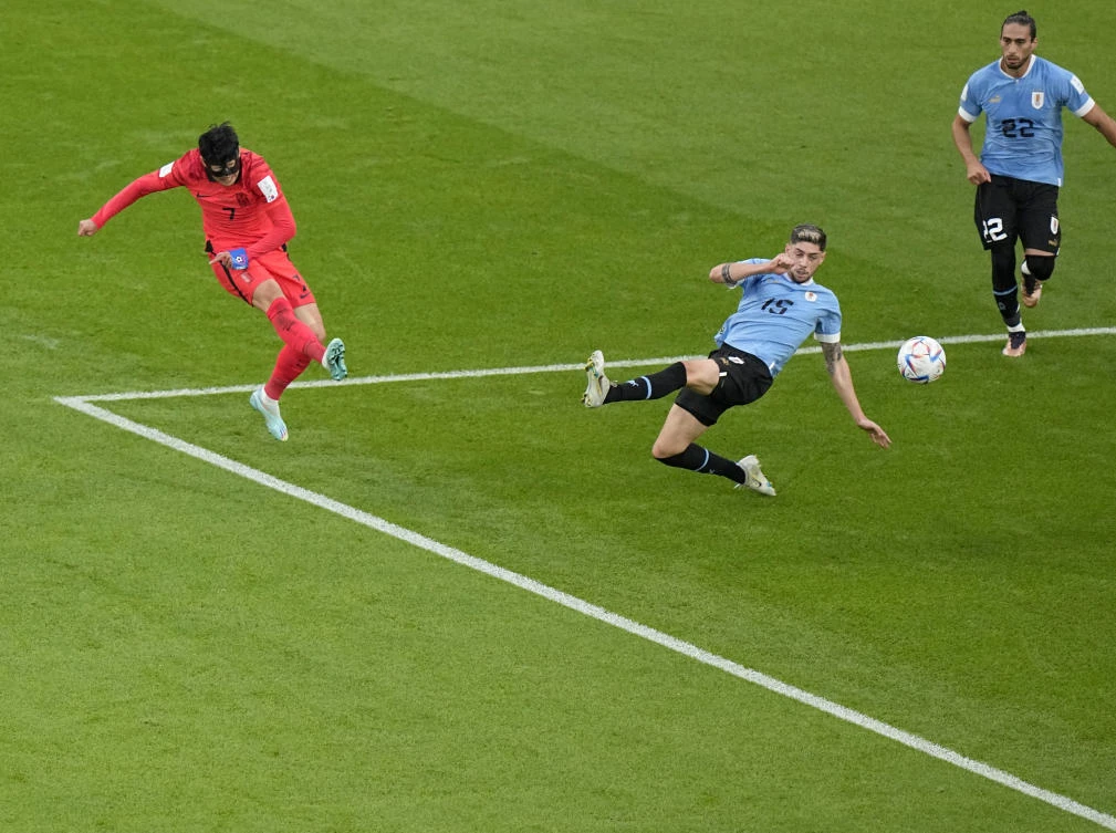 South Korea’s Son Heung-min shoots a goal attempt as Uruguay’s Federico Valverde tries to defend during their World Cup match at the Education City Stadium in Al Rayyan, Qatar on Thursday. (AP)