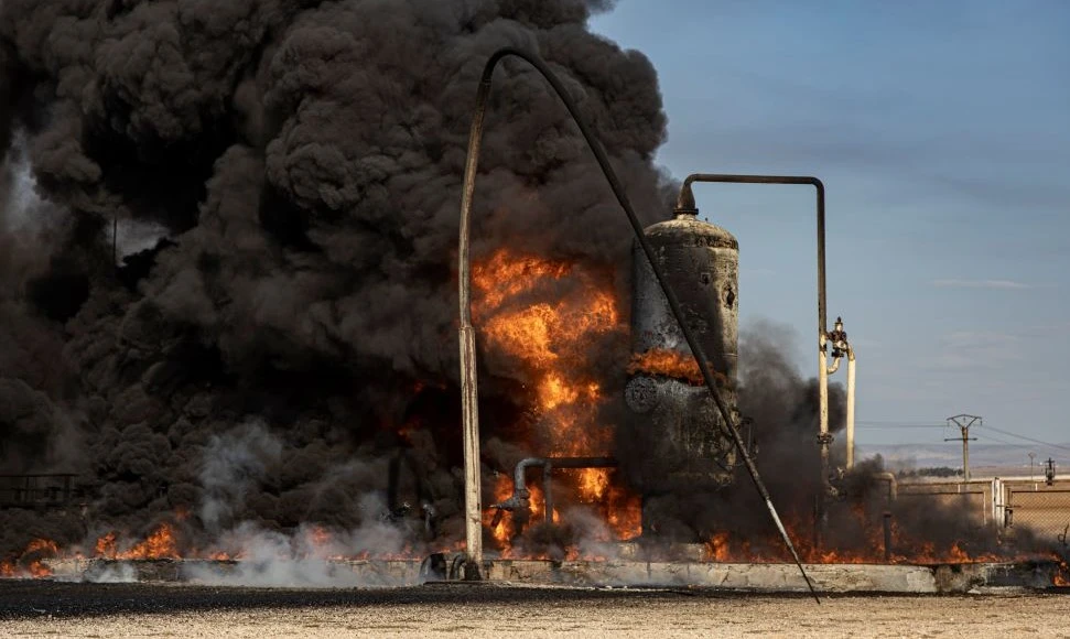Smoke rises from an oil depot, after a Turkish airstrike, near the town of Qamishli, Syria, Wednesday, Nov. 23, 2022. (AP Photo)