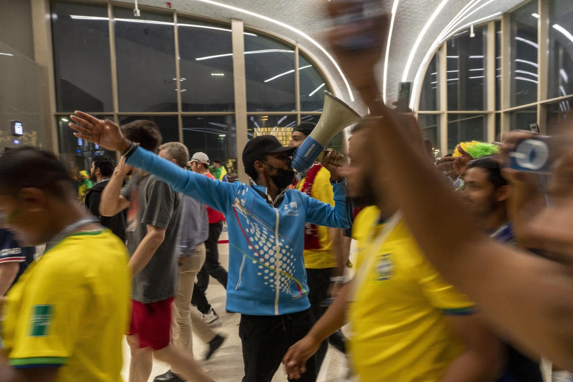 Seated all over Doha on high chairs more commonly used by lifeguards at swimming pools, these migrant workers have become a staple of the Middle East’s first World Cup. (AP)