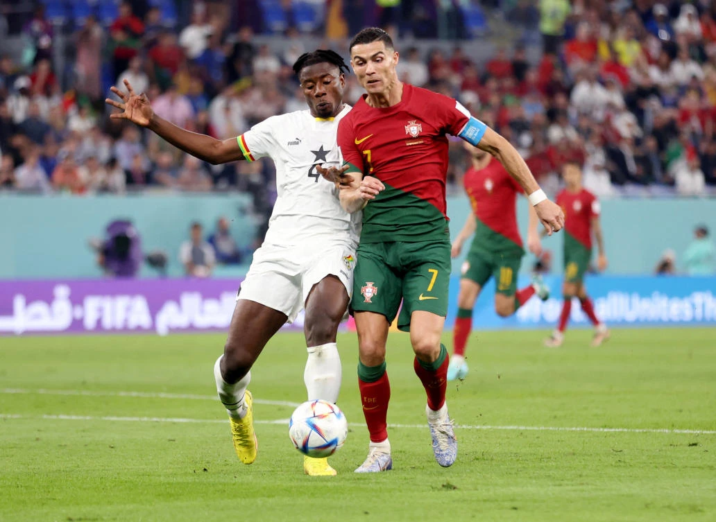 Ghana’s Mohammed Salisu concedes a penalty against Portugal’s Cristiano Ronaldo during their FIFA World Cup Qatar 2022 Group H match at Stadium 974 in Doha on November 24, 2022. (Reuters)