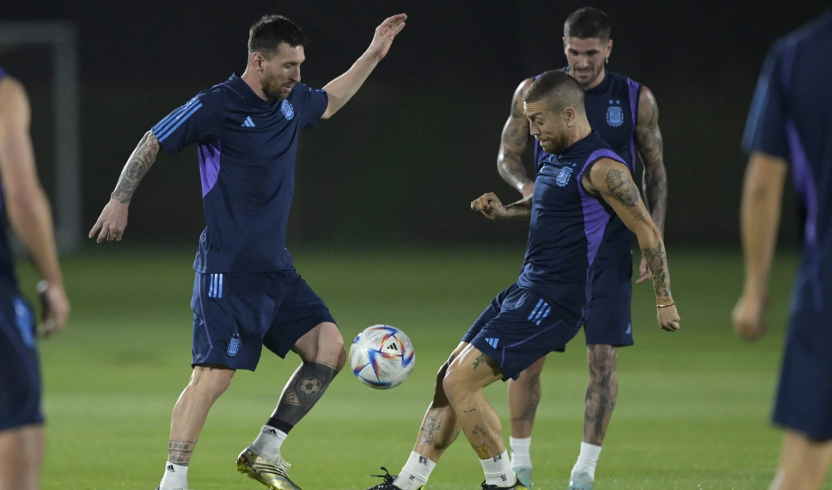 Argentina's forward Lionel Messi and midfielder Alejandro Gomez during a training session at the Qatar University in Doha on Tuesday, on the eve of the World Cup football match between Poland and Argentina. (AFP)