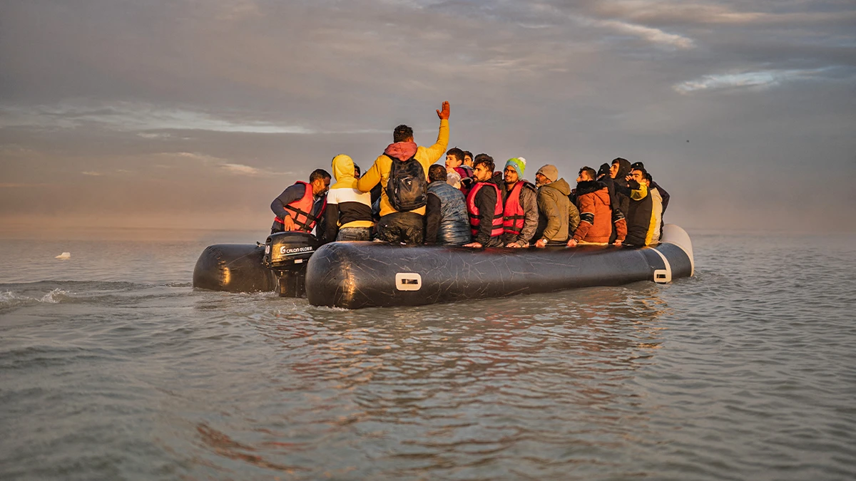 Migrants sail after boarding a smuggler's boat on the beach of Gravelines, near Dunkirk, northern France on October 12, 2022, in an attempt to cross the English Channel. (AFP/File)
