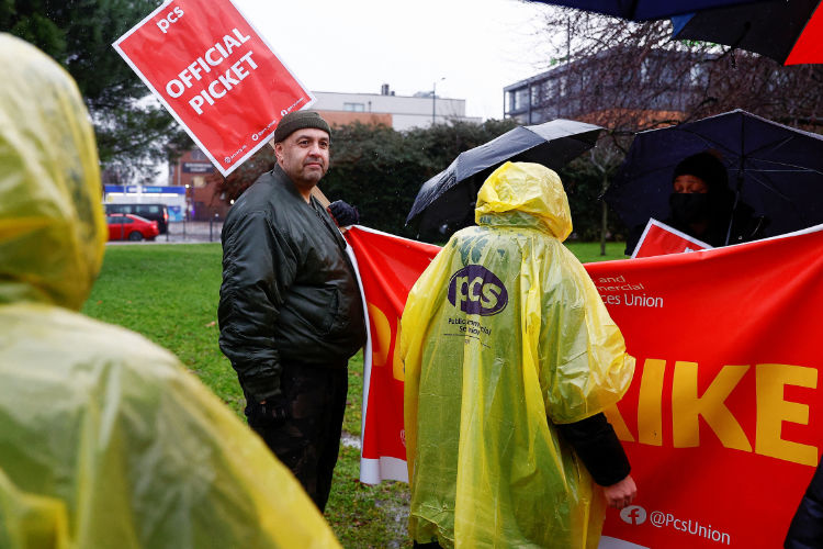 Members of the Public and Commercial Services Union take part in a border force workers strike, in London. (REUTERS)