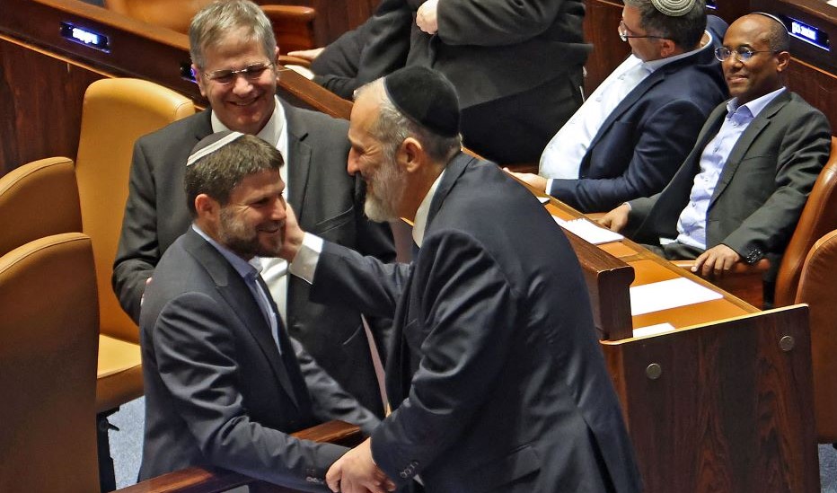 Religious Zionist Party leader Bezalel Smotrich and Shas party leader Aryeh Deri, Knesset, Jerusalem, Dec. 13, 2022. (AFP)