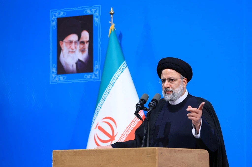 Above, Iranian president Ebrahim Raisi delivers a speech at Tehran University on Dec. 7, 2022. (Iranian Presidency/AFP)