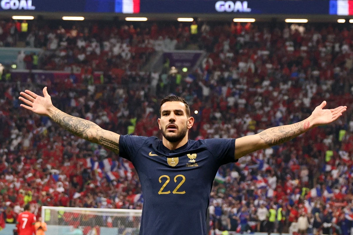 France's Theo Hernandez celebrates scoring his team's first goal during Qatar World Cup semi-final match against Morocco. AFP