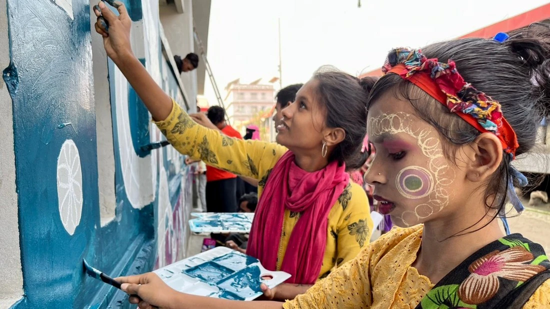 Rohingya refugee children paint a mural in Bhasan Char island, Bangladesh, Nov. 8, 2022. (UNHCR)