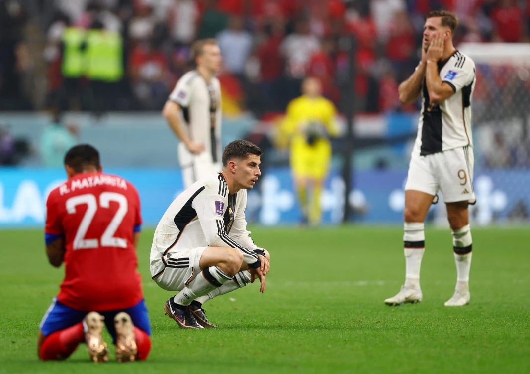 Kai Havertz, center, looks dejected as Germany are eliminated from the World Cup despite defeating Costa Rica 4-2 at Al Bayt Stadium, Al Khor, Qatar, December 1, 2022. (Reuters)