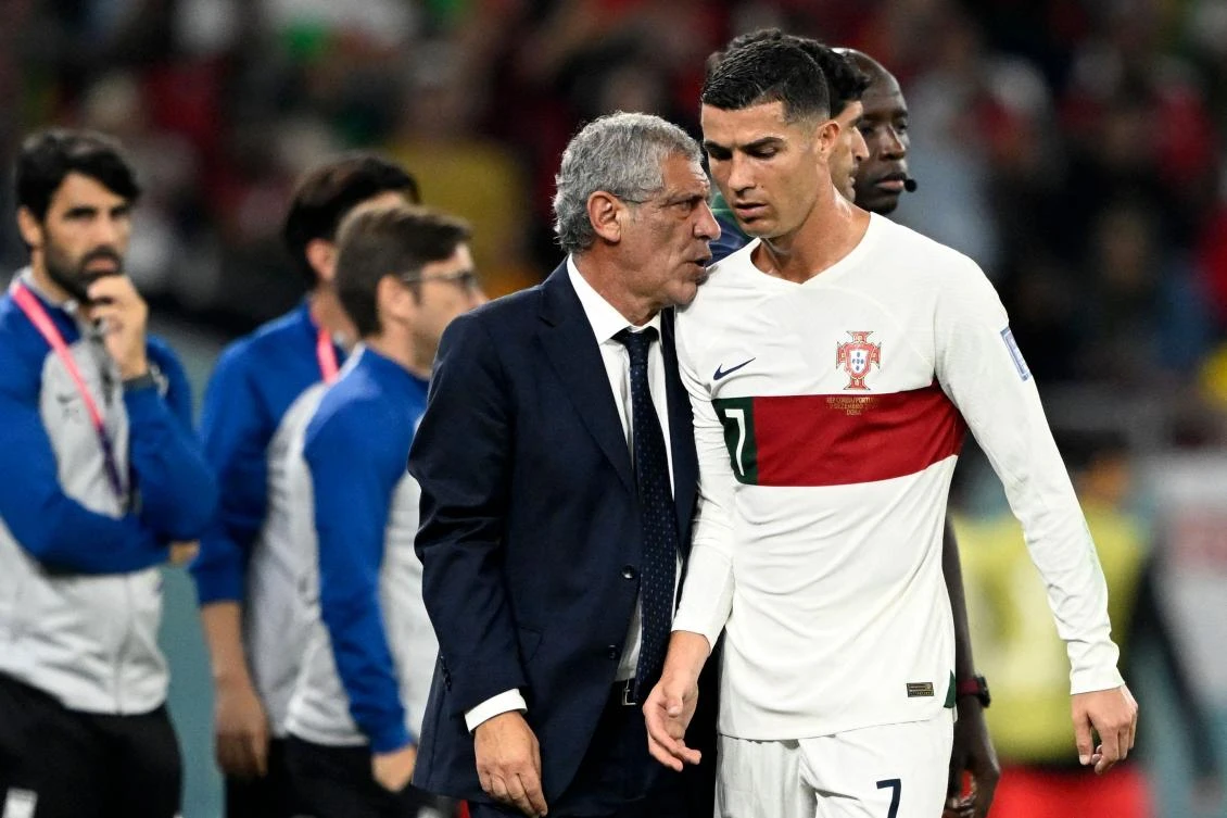 Portugal’s coach Fernando Santos greets Cristiano Ronaldo as he leaves the pitch during their World Cup Group H match against South Korea at the Education City Stadium in Al-Rayyan on Friday. (AFP)
