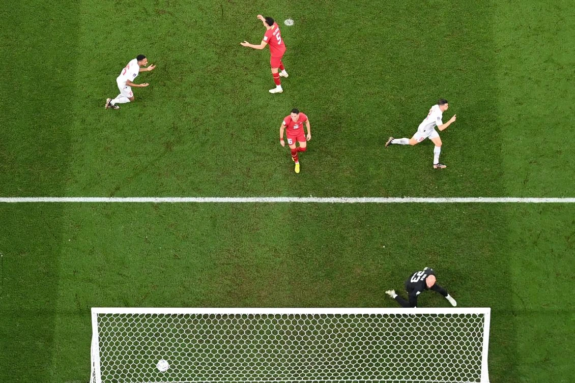 Switzerland’s midfielder Remo Freuler celebrates scoring his team’s third goal past Serbia’s goalkeeper Vanja Milinkovic-Savic during their World Cup Group G match at Stadium 974 in Doha on Friday. (AFP)