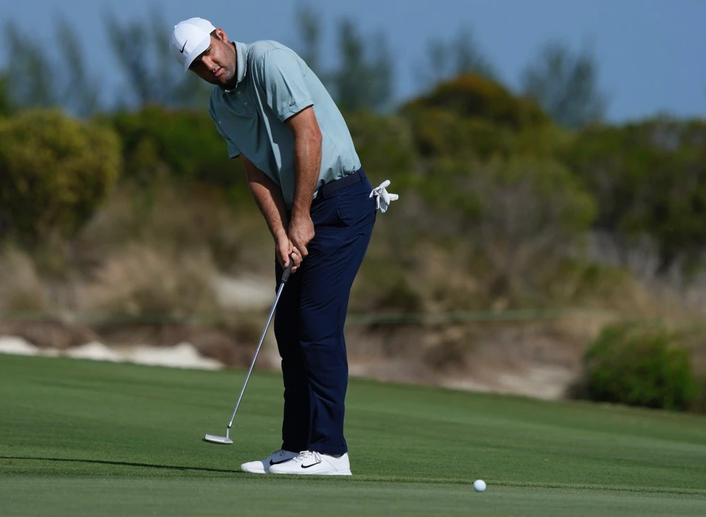 Scottie Scheffler of the US watches his ball on the 7th green during the second round of the Hero World Challenge PGA Tour at the Albany Golf Club in New Providence, Bahamas Friday. (AP)