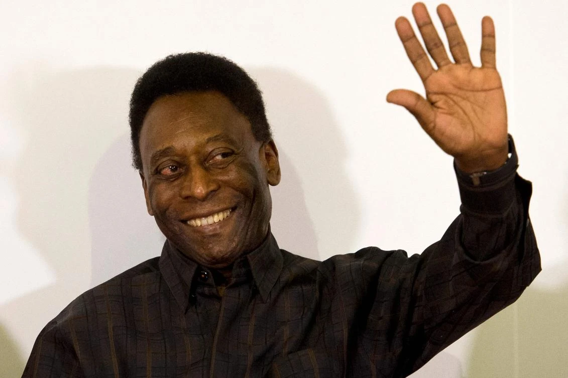 In this file photo taken on March 12, 2015, Brazilian football legend Pele waves during the autograph ceremony of his book “Segundo Tempo” (Second Half), in Santos, Brazil. (AFP)