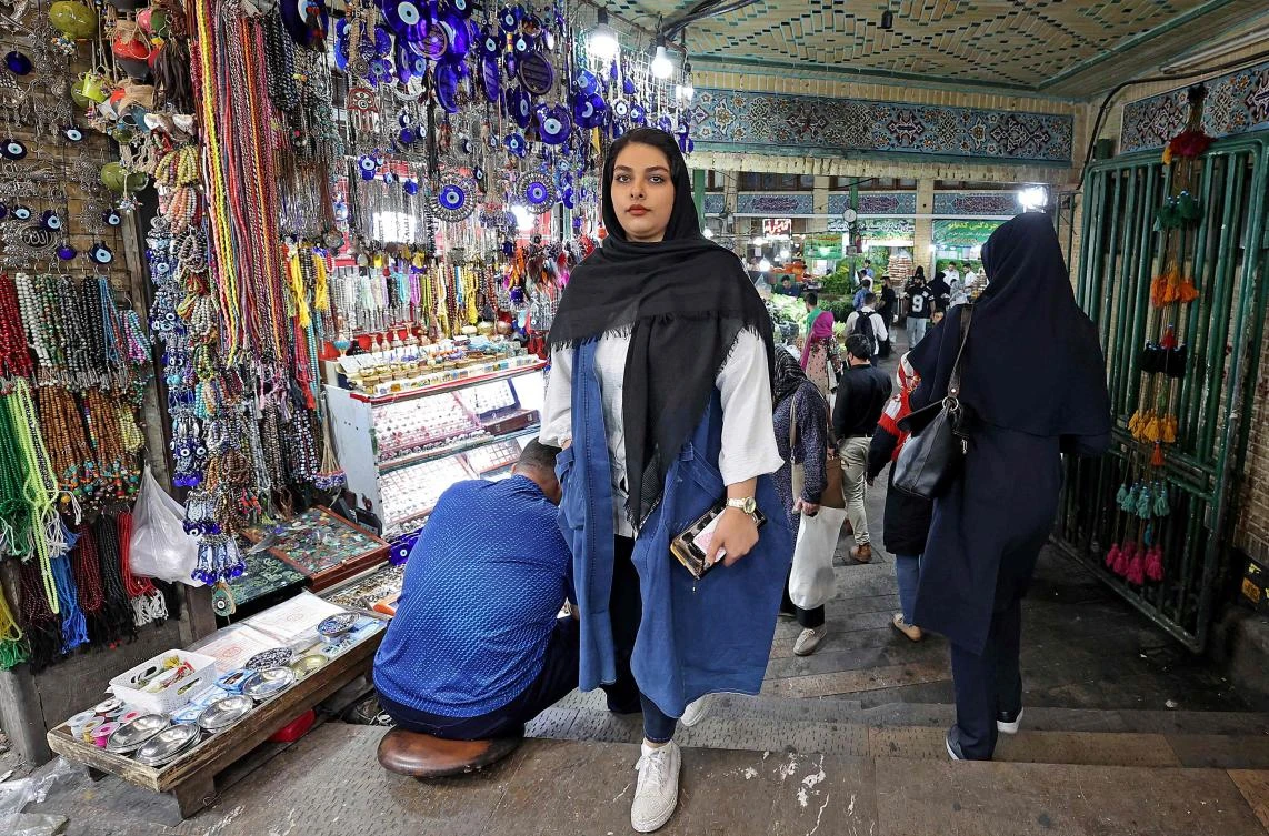 Iran's parliament and the judiciary are reviewing law which requires women to cover their heads, and which triggered more than two months of deadly protests. (AFP)