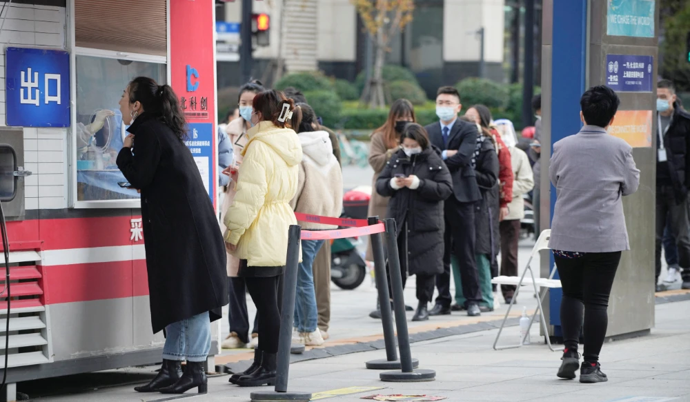 A woman gets tested at a nucleic acid testing site, as coronavirus disease (COVID-19) outbreaks continue in Shanghai, China, December 5, 2022. (REUTERS)