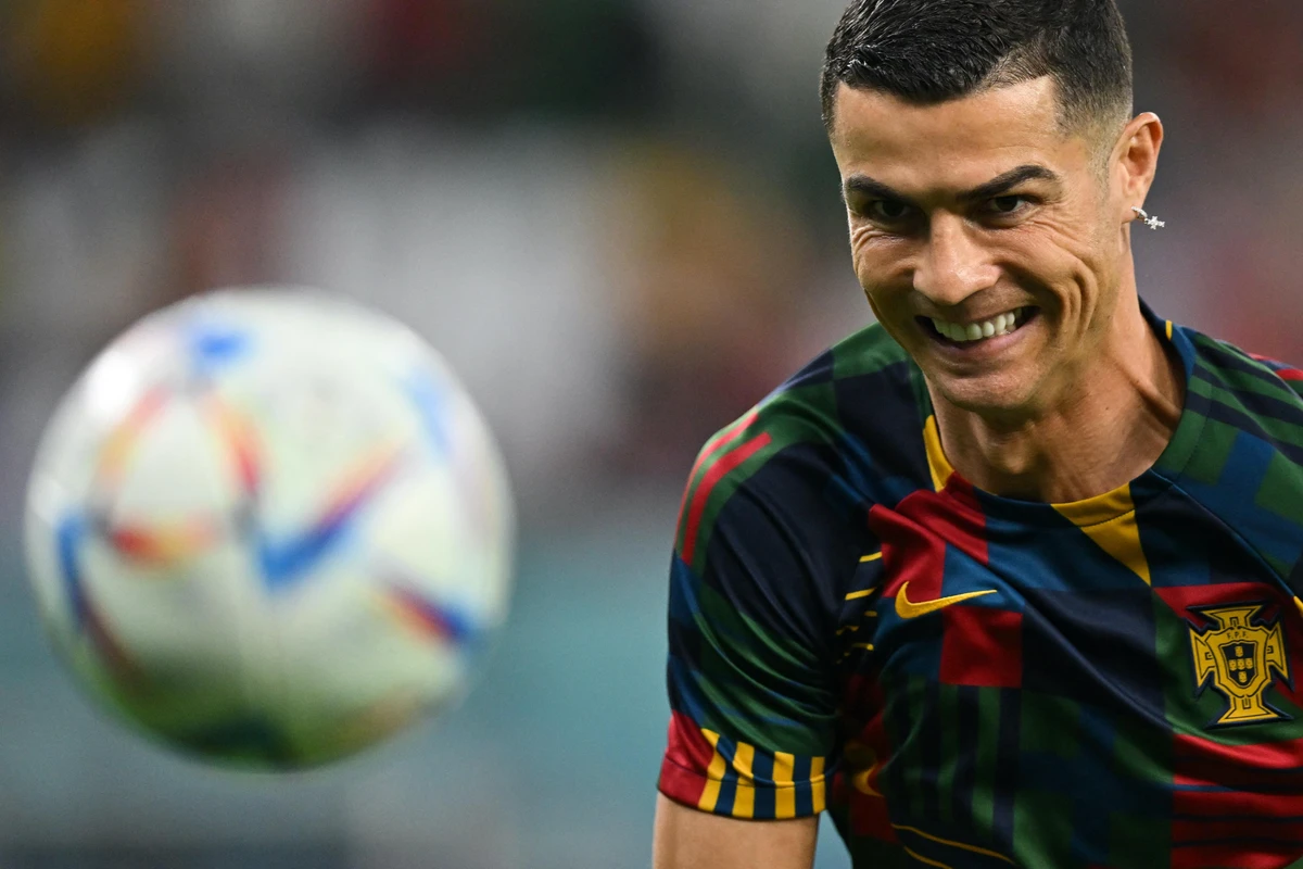 Portugal's forward Cristiano Ronaldo warms up ahead of the Qatar 2022 World Cup Group H match against South Korea. AFP