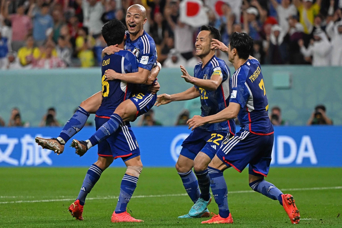 Japan's Daizen Maeda (2nd-L) celebrates with teammates after first goal during Qatar World Cup match against Croatia. AFP