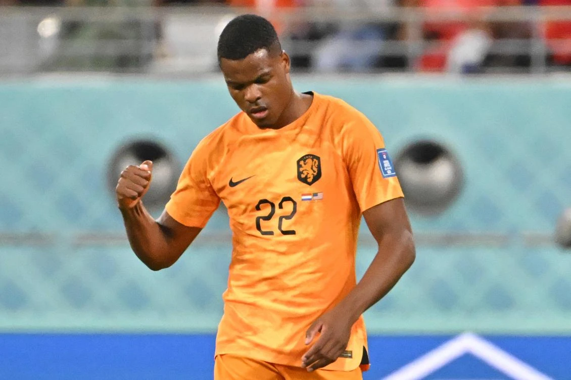 Netherlands’ defender Denzel Dumfries celebrates after Memphis Depay scored his team’s first goal during their World Cup round of 16 match against USA at Khalifa International Stadium in Doha on December 3, 2022. (AFP)