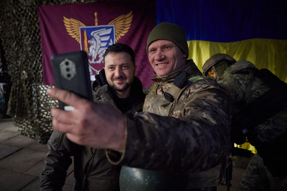 Ukrainian President Volodymyr Zelensky posing for a selfie picture with a Ukrainian soldier as he visits the Donetsk region, amid the Russian invasion of Ukraine on Tuesday. (AFP)