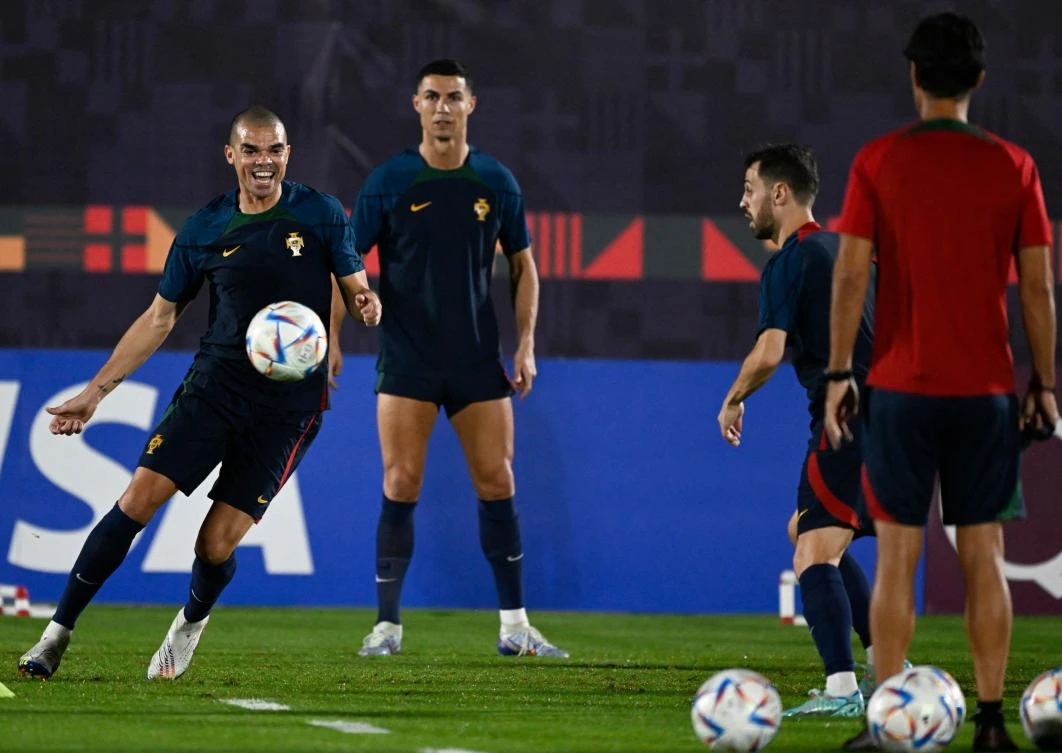 Portugal’s defender Pepe and Cristiano Ronaldo attend a training session at the Al Shahaniya SC training site, on Monday, on the eve of their World Cup Round of 16 match against Switzerland. (AFP)