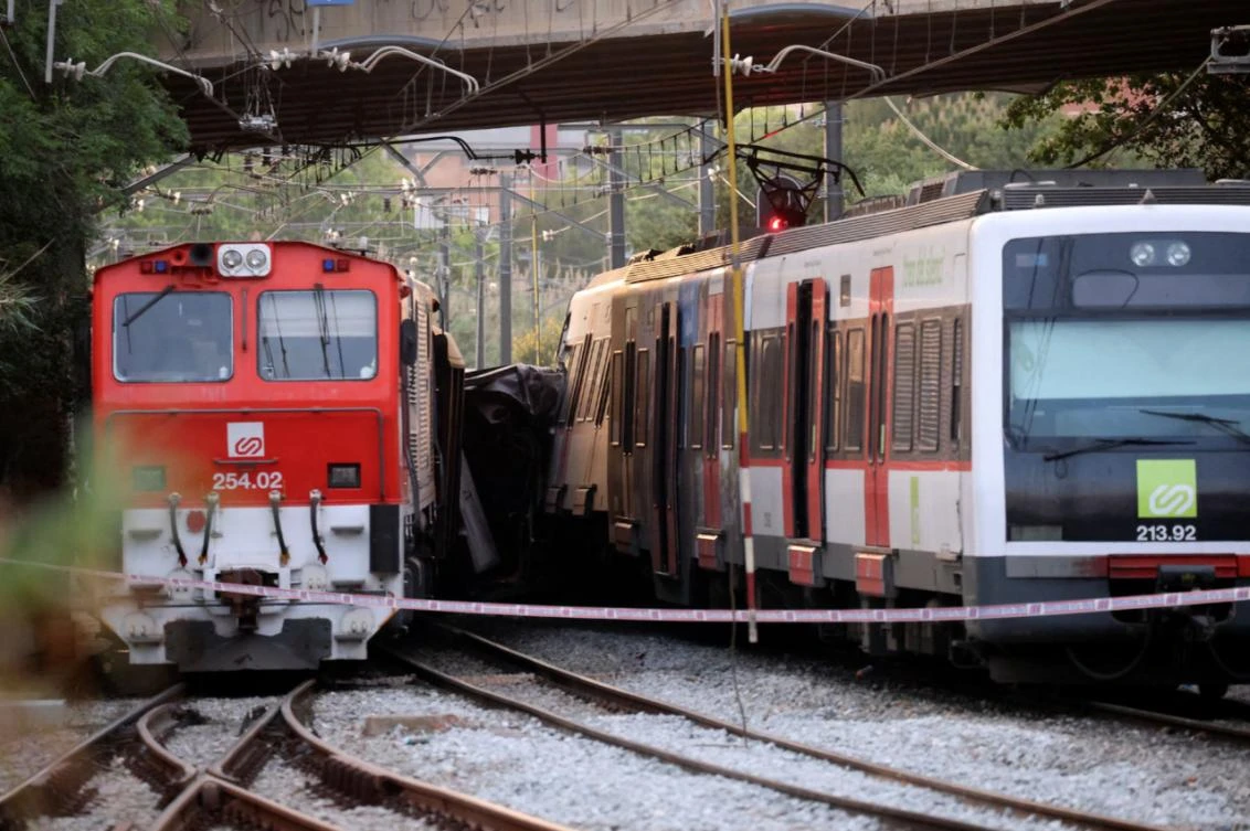 A commuter train and a goods train are pictured after they collided, on the outskirts of Barcelona, Spain May 16, 2022. (Reuters)