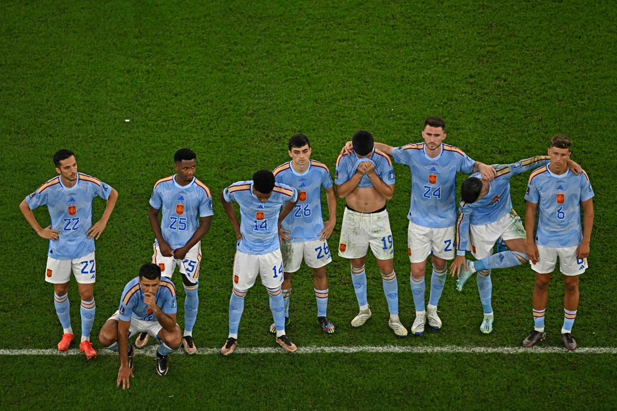Spain's players react during a penalty shootout at the end of the Qatar 2022 World Cup round of 16 match against Morocco. AFP
