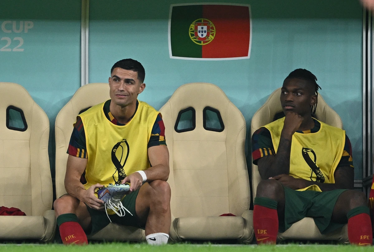 Portugal's Cristiano Ronaldo watches from the bench during the Qatar 2022 World Cup round of 16 match against Switzerland. AFP