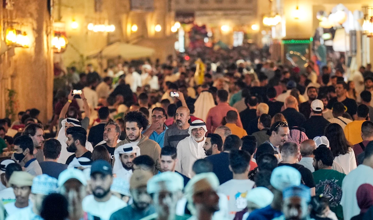 Thousand of locals and visitors walk the streets at the Souq Waqif marketplace during the World Cup in central Doha on Dec. 7, 2022. (AP)