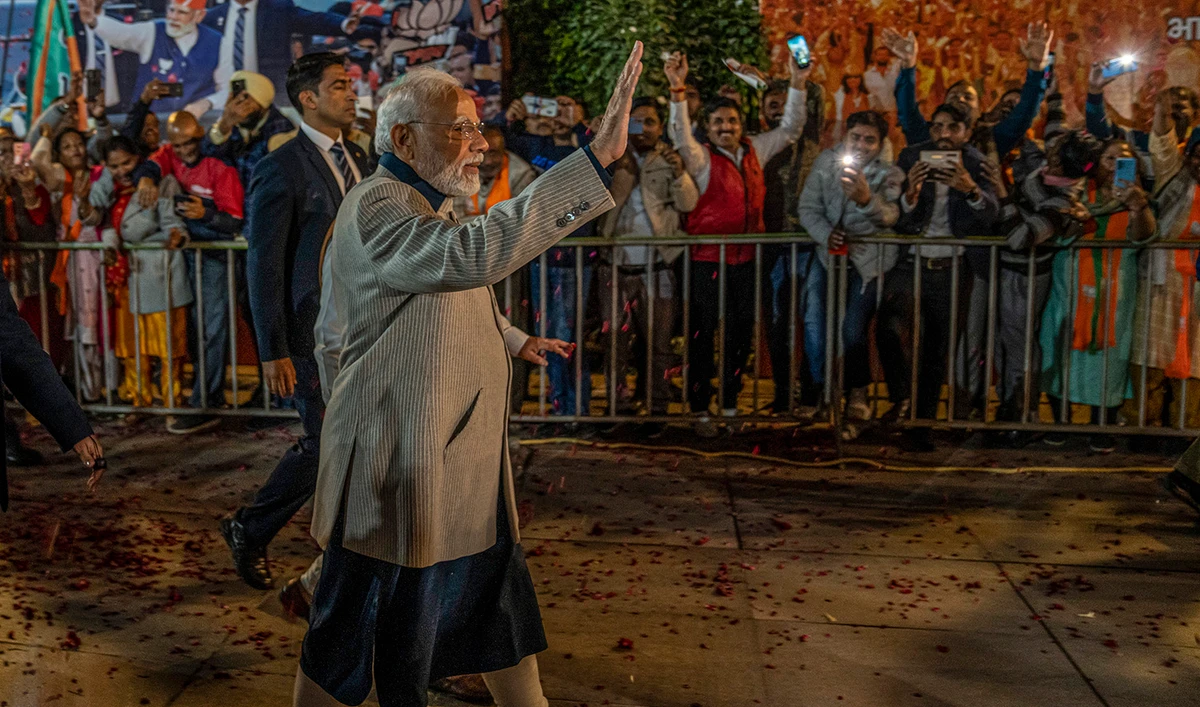 Indian Prime Minister Narendra Modi wave towards his supporters as he arrives at Bharatiya Janata party (BJP) headquarters in New Delhi, India, on December 8, 2022. (AP)