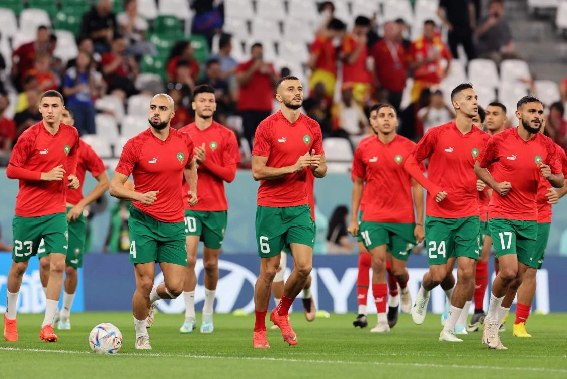 Morocco’s Bilal el Khannous, Sofyan Amrabat, Romain Ghanem Saiss, Badr Benoune and Sofiane Boufal warm up ahead of their World Cup round of 16 match against Spain at the Education City Stadium in Al-Rayyan on December 6, 2022. (AFP)